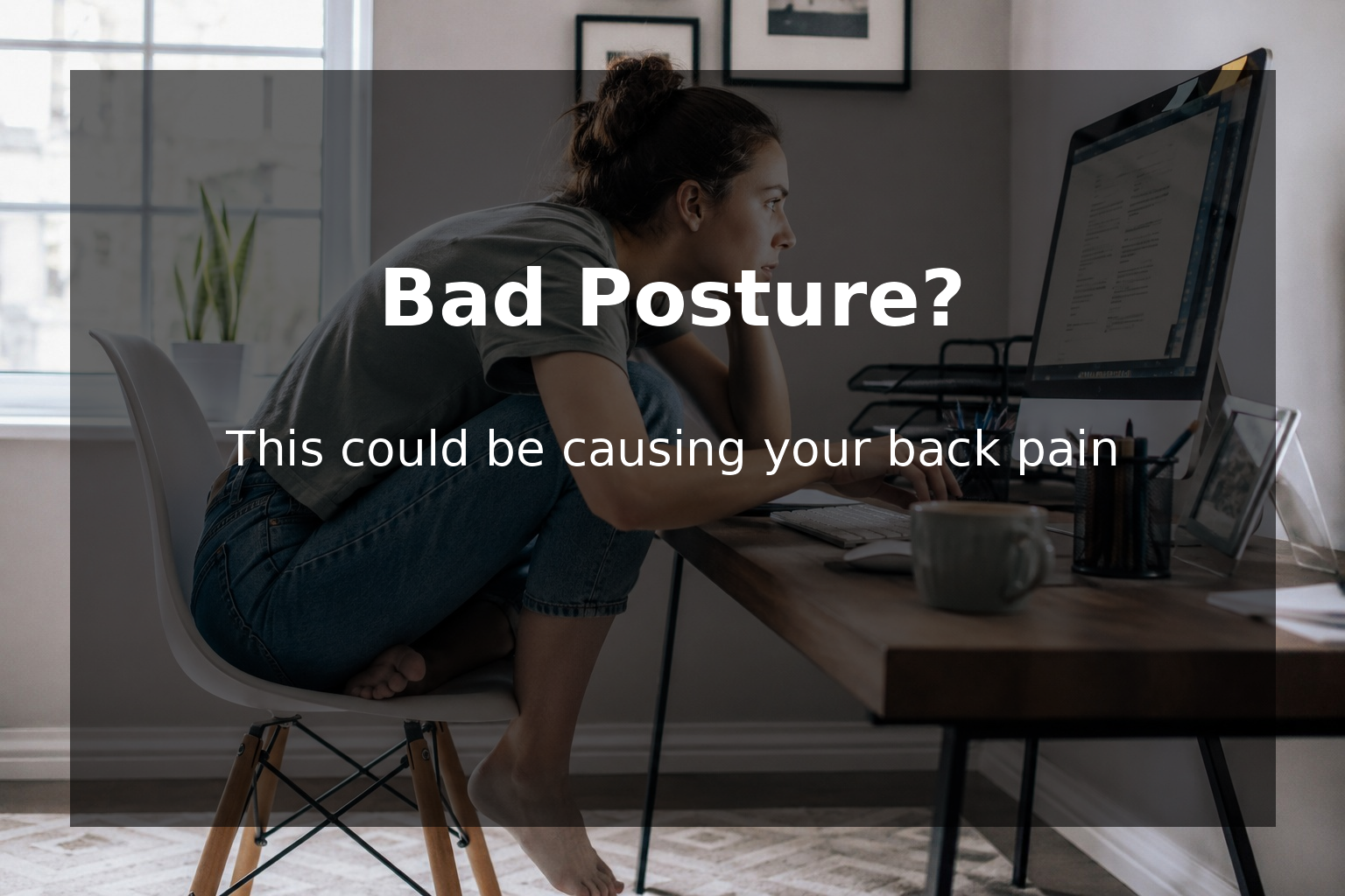 woman sitting in poor posture while working on computer causing back and neck pain